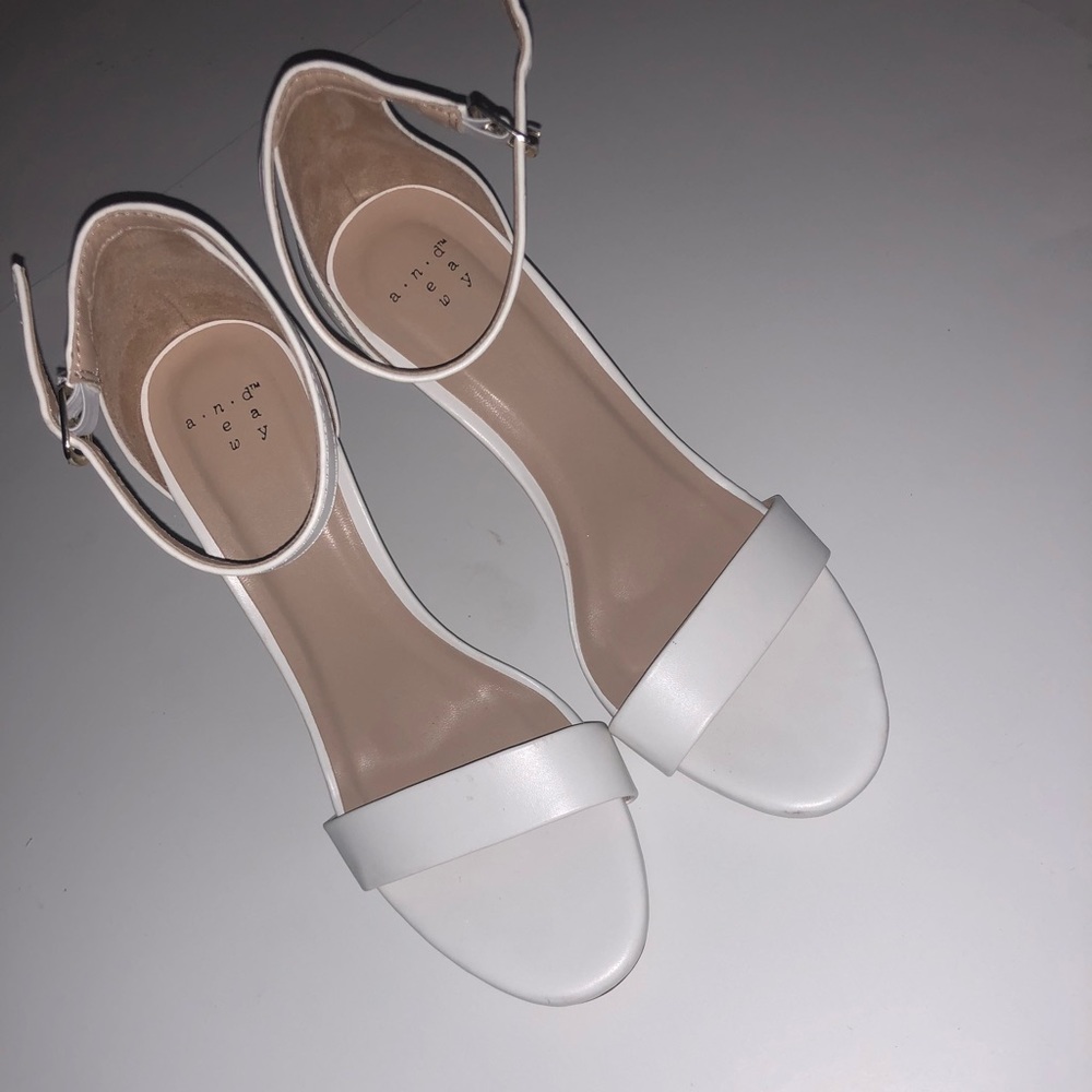 Woman’s white single strap heels